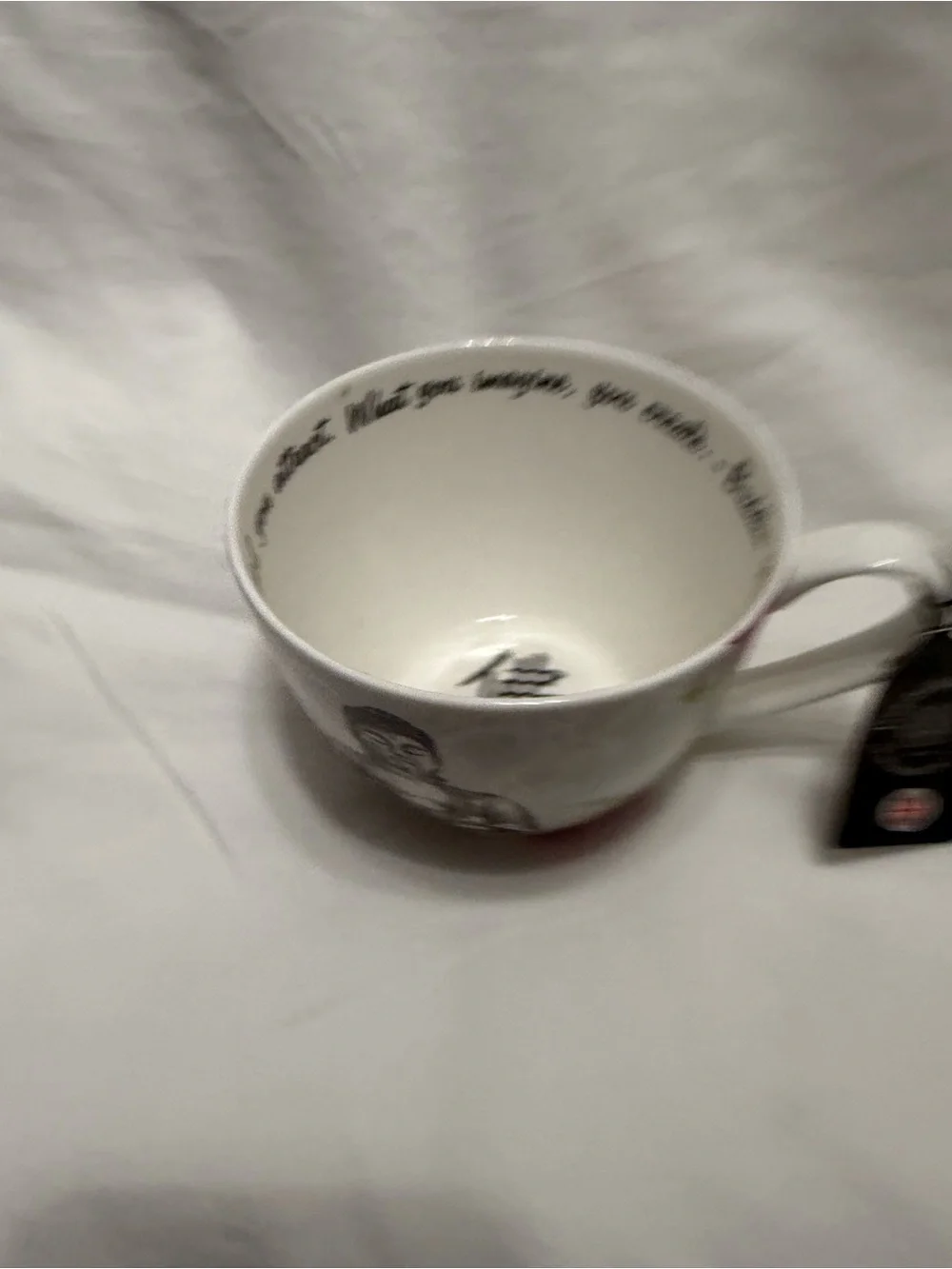 Buddha Stoneware Tea Cup - White and Black with Floral Accents